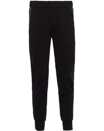 Prada Pantalon de jogging Re-Nylon à plaque logo - Noir