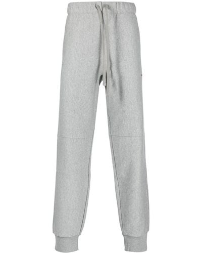 Carhartt Pantalones de chándal con logo bordado - Gris