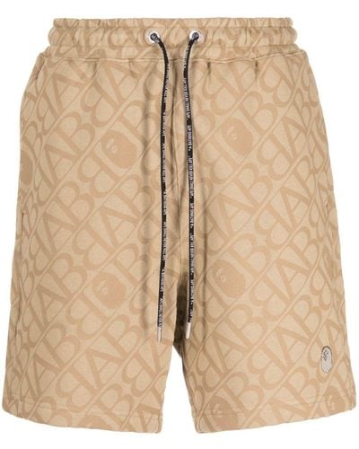 A Bathing Ape Kordelzug-Shorts mit Monogramm-Print - Natur