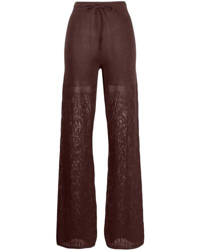 Nanushka Pantalones de ganchillo con logo - Marrón