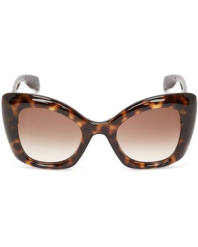 Alexander McQueen Gafas de sol cat eye con charms de calaveras - Marrón