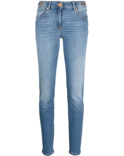 Versace Jean skinny à taille basse - Bleu