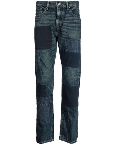 Neighborhood Ausgeblichene Jeans mit Patches - Blau