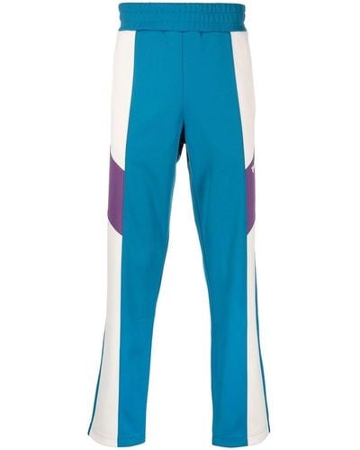 Palm Angels Pantalones de chándal con diseño colour block - Azul