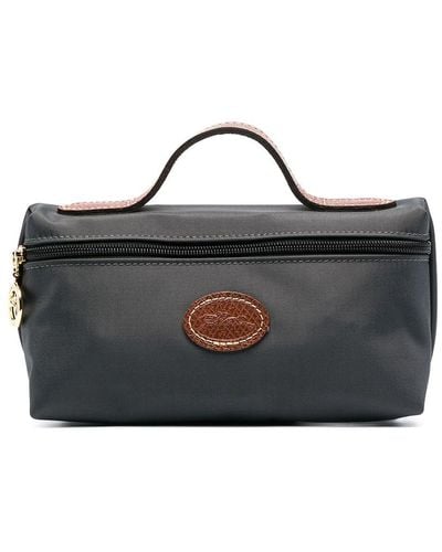 Shop Longchamp Unisex Plain Leather Logo Pouches & Cosmetic Bags