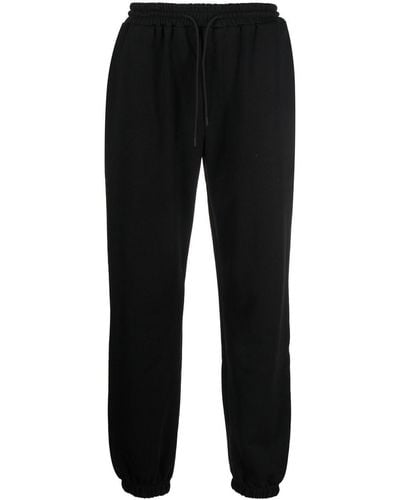 MSGM Pantalon de jogging en coton à logo imprimé - Noir