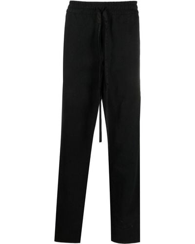 Rhude Pantalones de chándal con rayas laterales - Negro