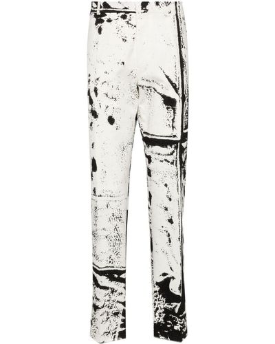 Alexander McQueen Pantalon fuselé à imprimé graphique - Blanc