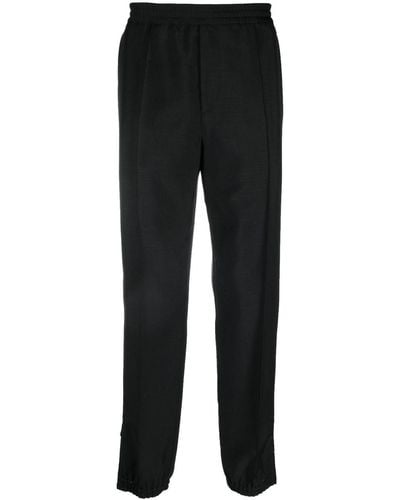Versace Pantalon de jogging à chevilles zippées - Noir