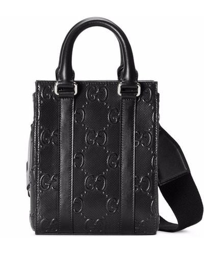 Gucci Petit sac cabas en cuir à logo GG embossé - Noir
