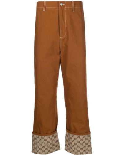 Gucci Pantalon à ourlets retroussés en toile GG - Orange