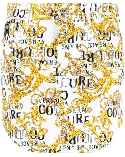 Versace Logo Couture-print Denim Miniskirt - Metallic