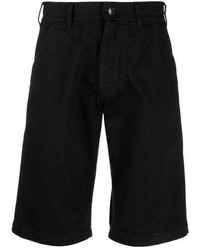 Raf Simons Pantalones vaqueros cortos con parche del logo - Negro