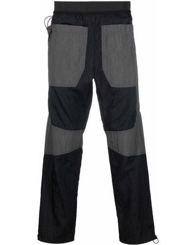 Arnar Mar Jonsson Pantalones rectos con diseño colour block - Negro