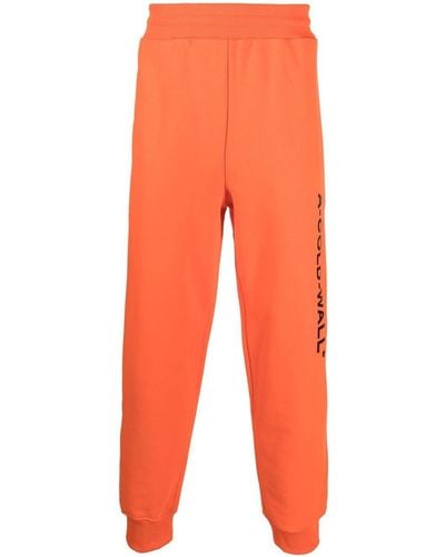A_COLD_WALL* Pantalones de chándal con logo estampado - Naranja