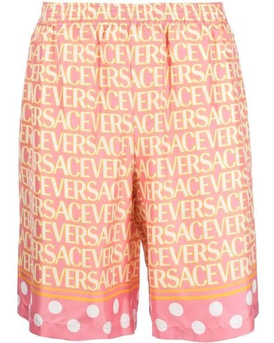 Versace Shorts in seta a stampa - Arancione