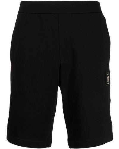 Armani Exchange Pantalones de chándal con parche del logo - Negro