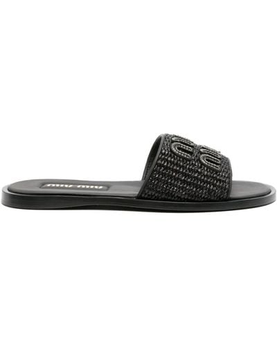 Miu Miu Sandalias con logo en relieve - Negro