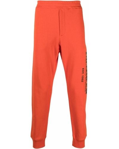 Alexander McQueen Pantalones de chándal con logo - Rojo