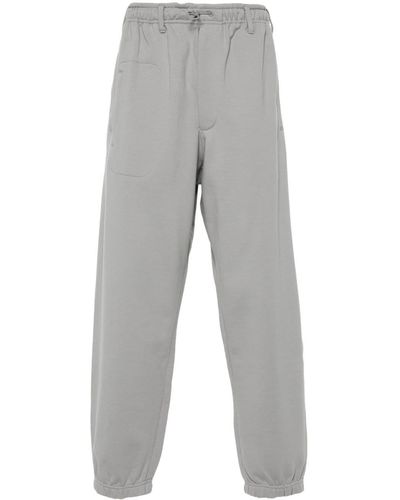 Y-3 Pantalones de chándal con cierre de trenca - Gris