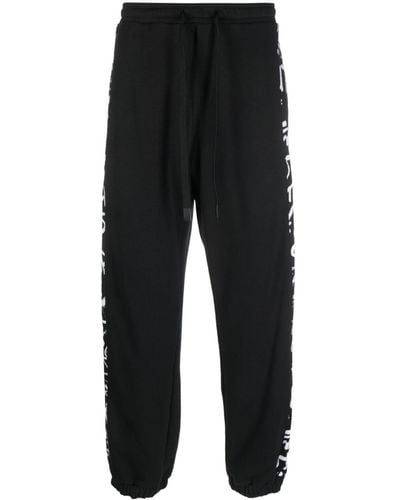 Versace Pantalon de jogging rayé à lien de resserrage - Noir