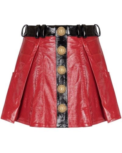 Balmain Minifalda de charol plisada - Rojo