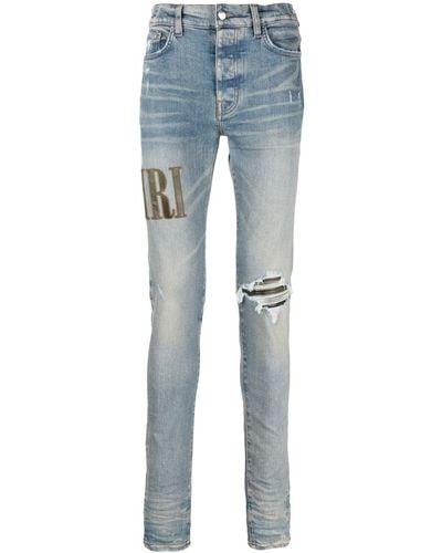 Amiri Light E Ripped Skinny Jeans With Embroidery In Cotton Man - Blue