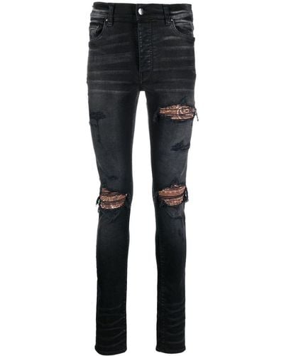 Amiri Ripped Skinny-fit Jeans - Black