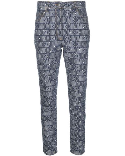 Moschino Skinny-Jeans mit Monogramm-Print - Blau