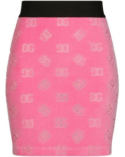 Dolce & Gabbana Flocked Jersey Miniskirt With All-Over Dg Logo - Pink