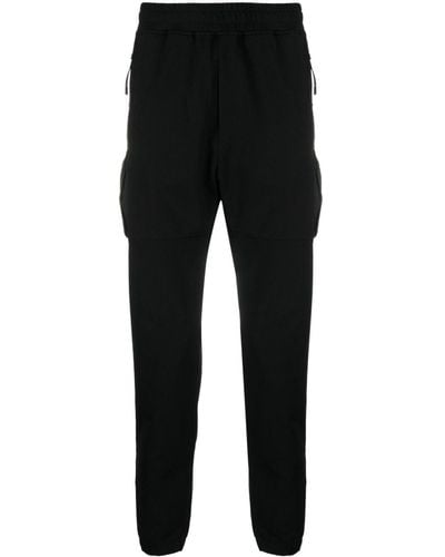 C.P. Company Pantalones de chándal ajustados con logo - Negro