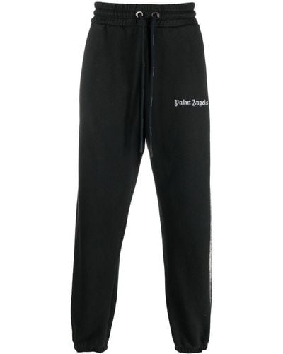 Palm Angels Pantalon de jogging en coton à logo imprimé - Noir