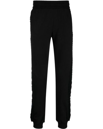 Versace Pantalones de chándal con logo estampado - Negro