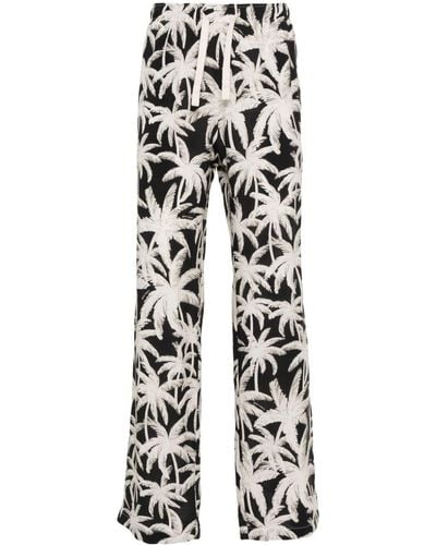 Palm Angels Pantalon ample à imprimé graphique - Blanc