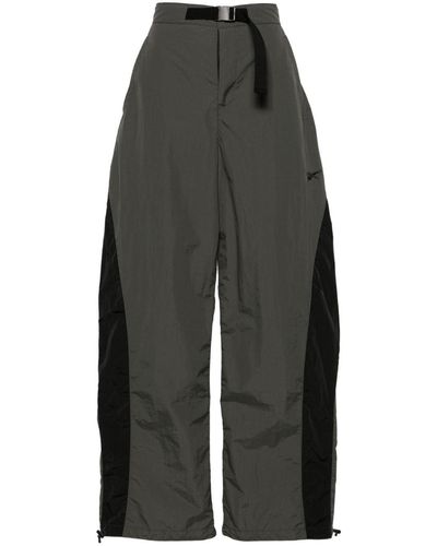 Reebok Pantalon ample à empiècements - Gris