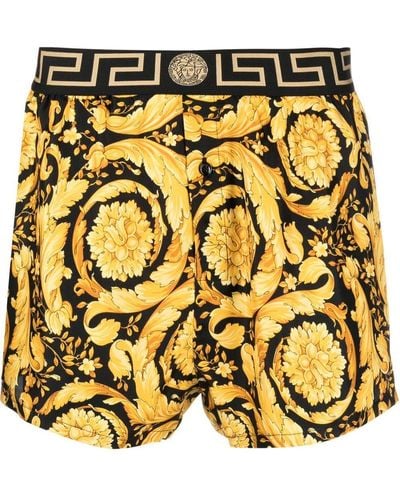 Versace Seidenshorts mit barockem Print - Gelb