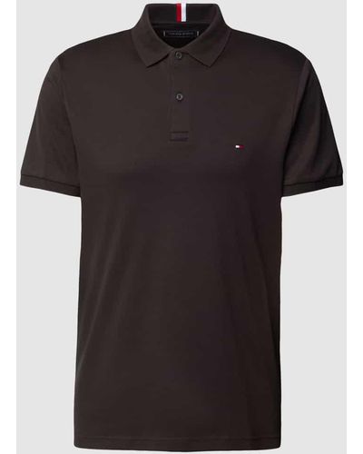 Tommy Hilfiger Regular Fit Poloshirt mit Label-Stitching - Schwarz