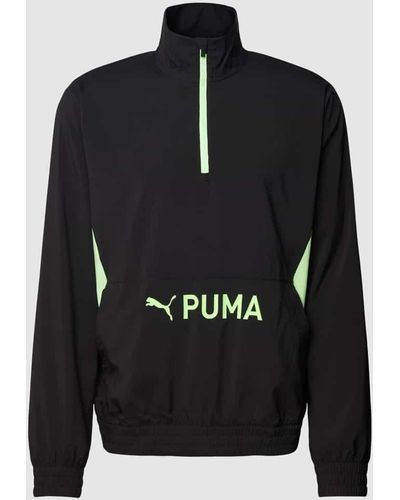 PUMA PERFORMANCE Sweatshirt mit kurzem Reißverschluss Modell 'Woven' - Schwarz