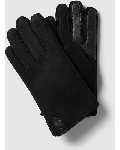 UGG Handschuhe aus Lammfell mit Label-Patch - Schwarz