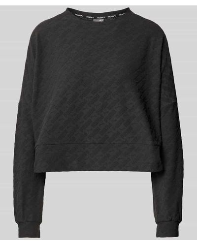 PUMA Cropped Sweatshirt mit Strukturmuster - Schwarz