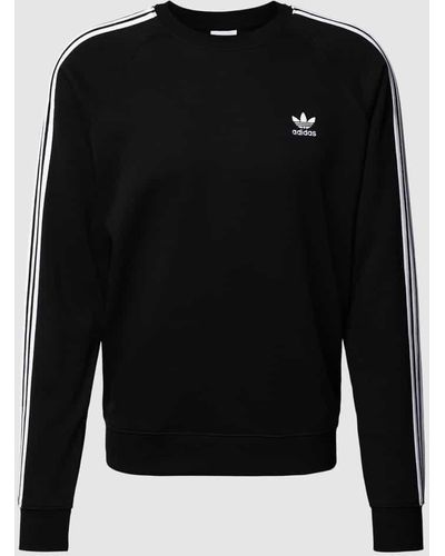 adidas Originals Sweatshirt mit Galonstreifen - Schwarz