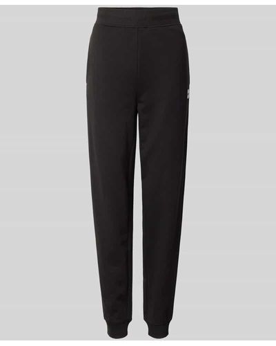 HUGO Regular Fit Sweatpants mit Label-Stitching Modell 'NELFINIA' - Schwarz