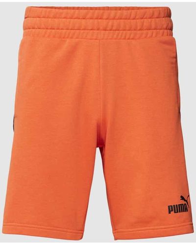 PUMA Sweatshorts mit Label-Print - Orange