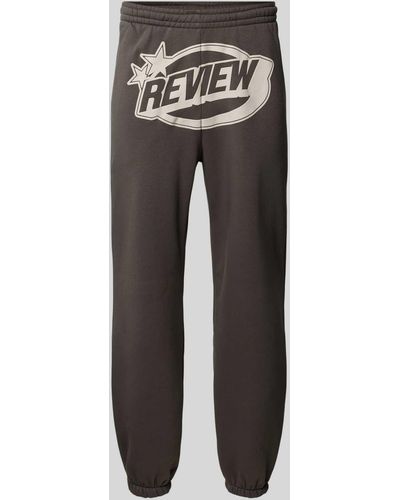 Review Regular Fit Sweatpants mit Label-Print - Schwarz