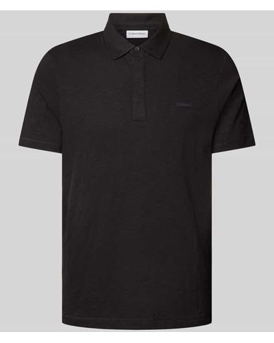 Calvin Klein Regular Fit Poloshirt mit Knopfleiste - Schwarz