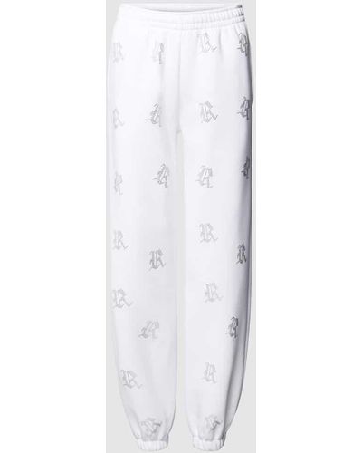 Review Sweatpants mit Allover-Logo-Print aus Ziersteinen - Weiß