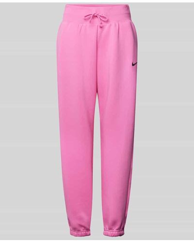 Nike Loose Fit Sweatpants mit Logo-Stitching - Pink