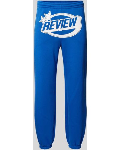 Review Regular Fit Sweatpants mit Label-Print - Blau