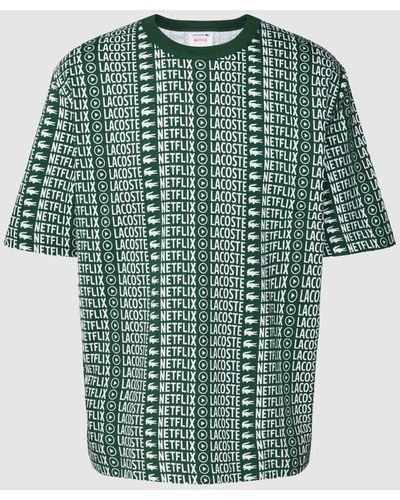Lacoste X Netflix - T-Shirt mit Allover-Print - Grün