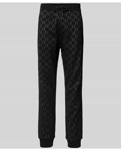 Karl Lagerfeld Regular Fit Sweatpants mit Allover-Label-Print - Schwarz